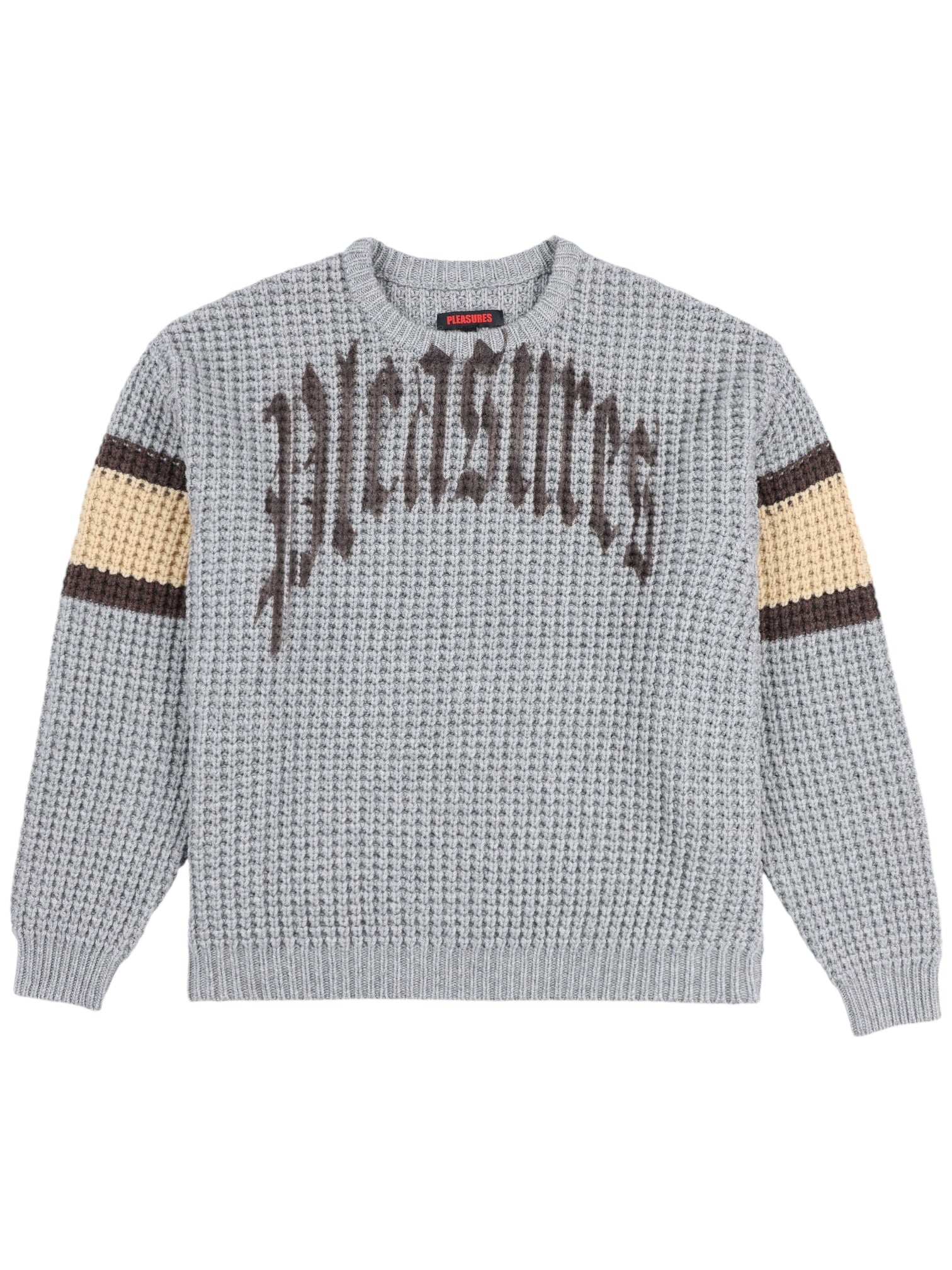 The Pleasures Twitch Chunky Knit Sweat Grey by PLEASURES is a cozy sweater with "Pleasures" in black across the chest. Crafted from a soft wool blend, it features stylish brown and beige stripes on each sleeve.