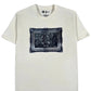 The Probus Frame Tee Cream by PROBUS is an oversized white t-shirt with a centered framed sketch of a cartoon character, made from 100% cotton.