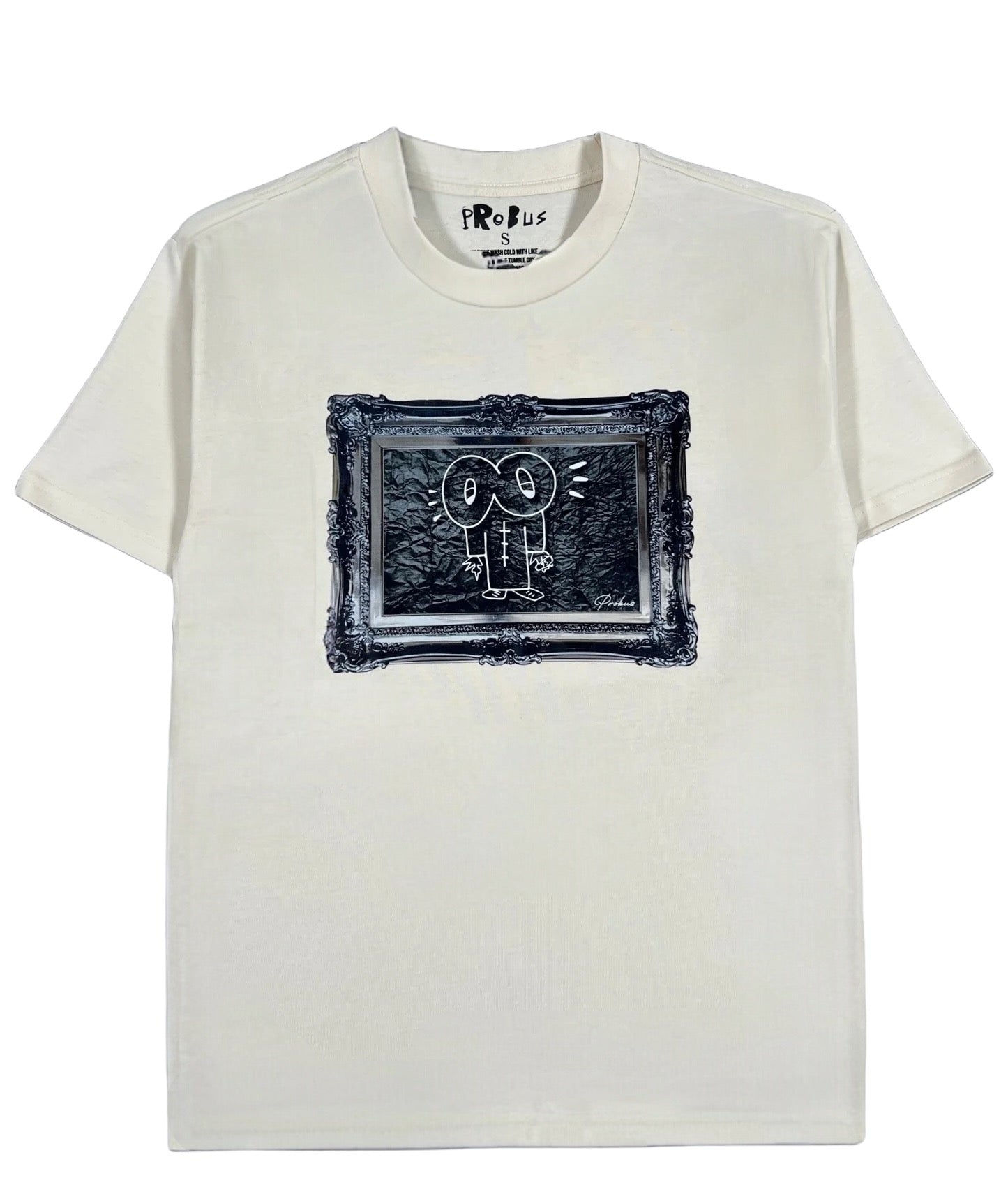 The Probus Frame Tee Cream by PROBUS is an oversized white t-shirt with a centered framed sketch of a cartoon character, made from 100% cotton.