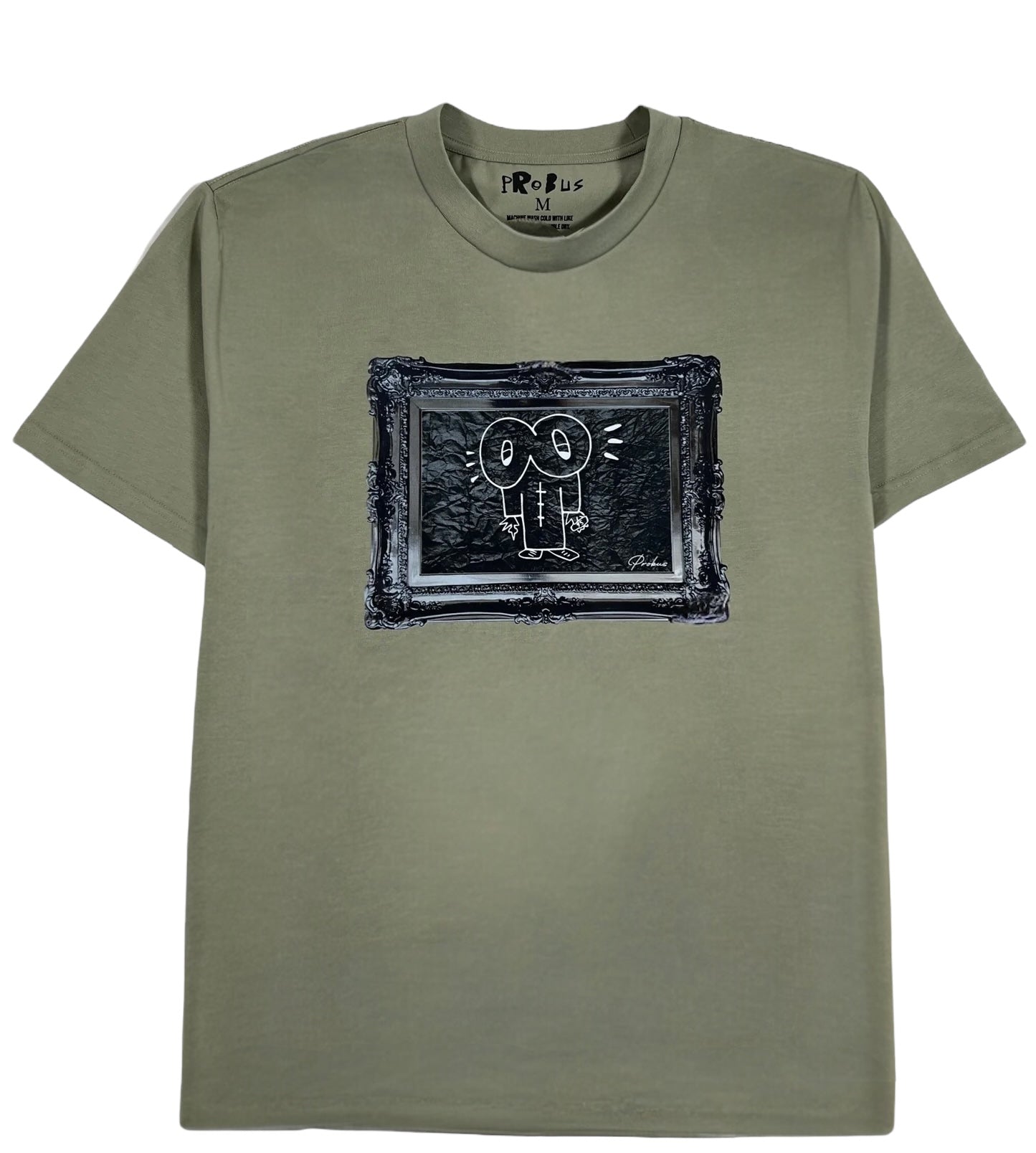 The Probus Frame Tee Olive by PROBUS features a cartoon face graphic inside a picture frame design on the front.