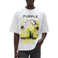 A man in sunglasses wears the PURPLE BRAND M1057-TWFM325 Textured Jersey Top in white, an oversized 100% cotton tee with "PURPLE" text and a digital explosion graphic, paired with dark jeans.