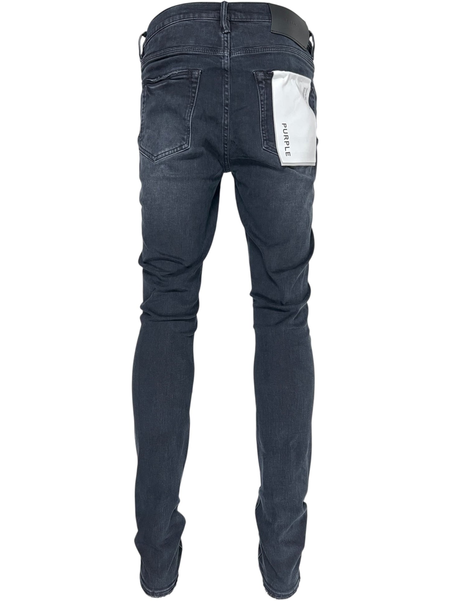 A person wearing Probus Purple Brand P001-SHFL425 Skinny Hotfix Logo Black jeans, featuring a white "PURPLE" patch on the back right pocket, viewed from behind.