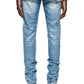 Someone wearing PURPLE BRAND's P001-SKCI Skinny Coated Lt Indigo jeans, a white T-shirt, and white sneakers is photographed from the back against a crisp white backdrop.