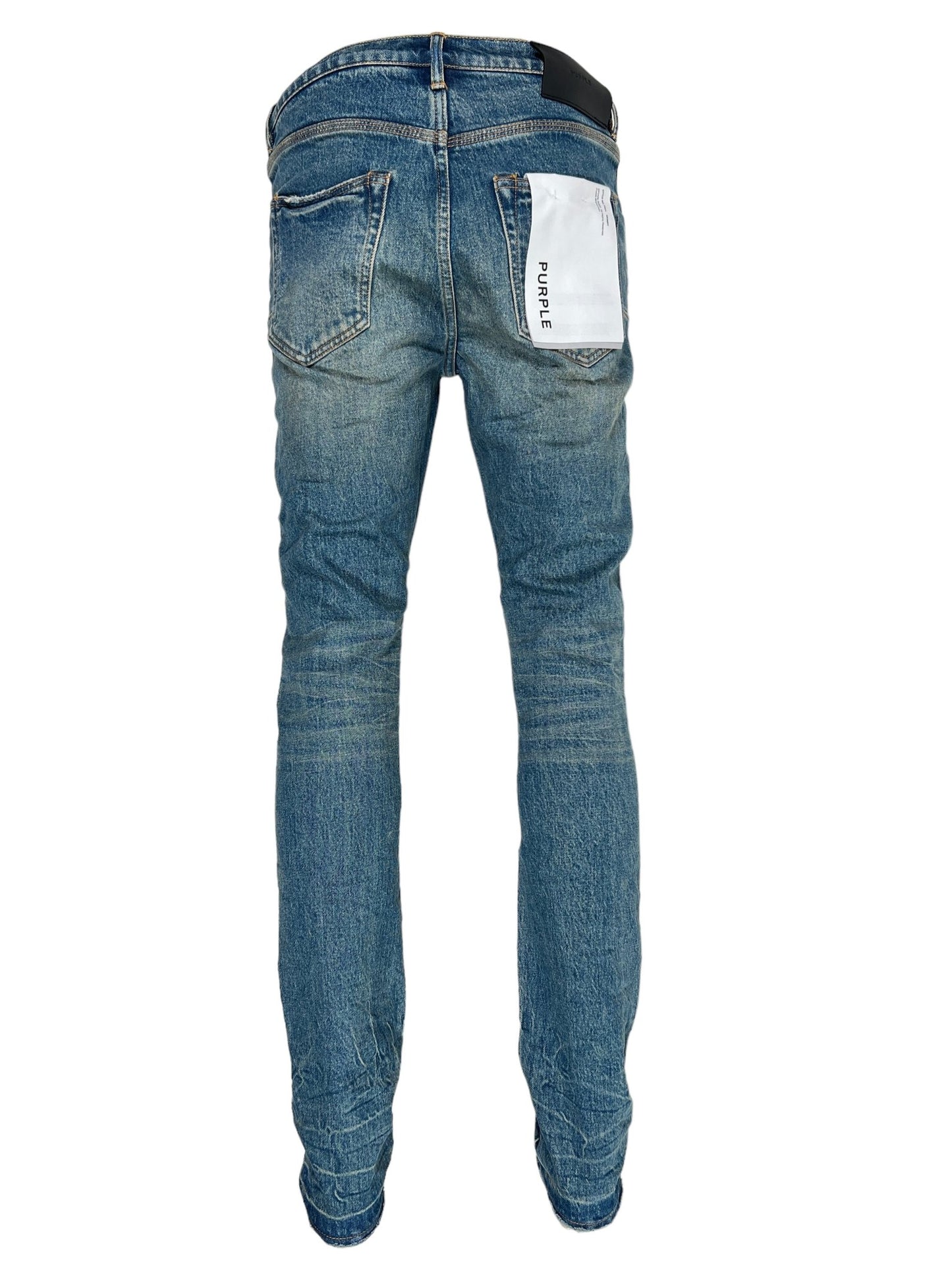 Rear view of a pair of PURPLE BRAND P001-SNFD SKINNY 9 TO 5 DK INDIGO jeans with a visible brand label on the right back pocket, perfect for the Fall Winter 2024 season.