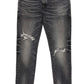 A pair of Purple Brand P001-SWKO Skinny Week Old Wash Black jeans from PURPLE BRAND, crafted from premium stretch denim with visible rips on the thighs, faded areas, and designed in a low-rise skinny fit.
