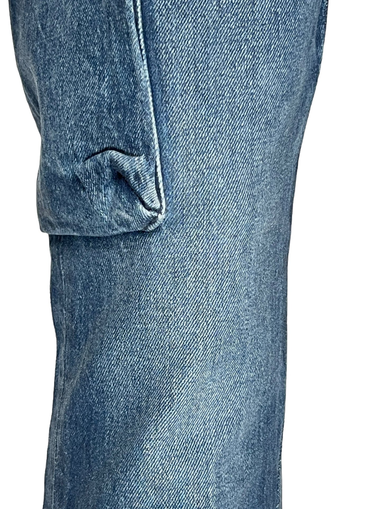 Close-up view of PURPLE BRAND P004-CFGS Cargo Flare Vintage Coated DK Indigo jeans with a visible side pocket seam on the left leg.