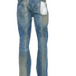 The PURPLE BRAND P004-GBMF Gaia Blowout Flare Indigo Denim features a rear view of stylish faded blue jeans with a "Purple" label on the back pocket, embodying the indigo trend. A must-have for Spring/Summer 2025, these jeans showcase the sophisticated style of Purple Brand denim.