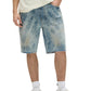A person wearing PURPLE BRAND Purple Brand P059-MXPS Mixed Paint Shorts Indigo, white socks, cream sneakers, and a cream textured shirt. Only the lower body is visible.