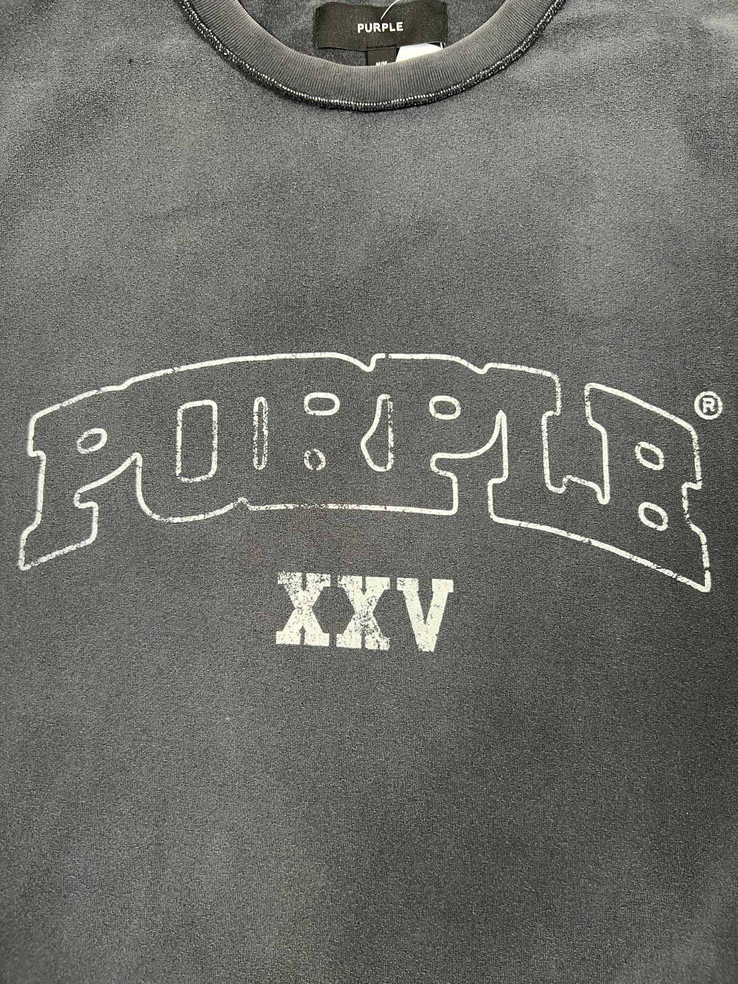 The Purple Brand P101-TBSO425 Textured Inside Out Tee Blk is a dark gray 100% cotton tee featuring large arched “PURPLE” and “XXV” in white, from PURPLE BRAND.