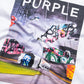 The PURPLE BRAND P101-TWPU325-Inside Out Tee in Brilliant White features spray-painted graffiti on racetrack barriers, the word "PURPLE" at the top, and a fabric wrinkle subtly distorting the image.