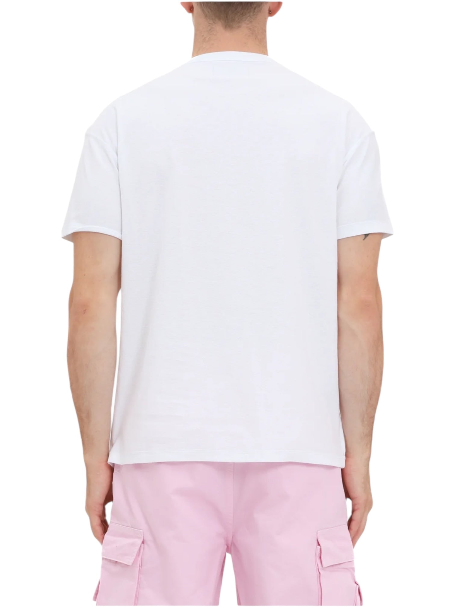 A person is shown from the back wearing a PURPLE BRAND P101-TWPU325-Inside Out Tee Brilliant White and light pink cargo shorts.