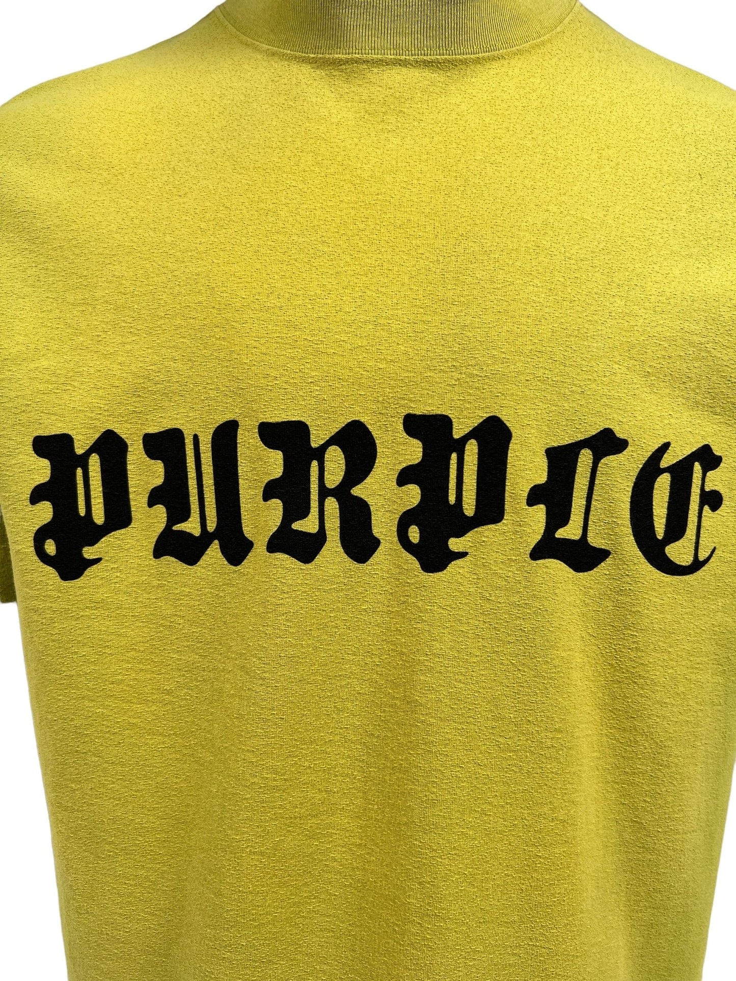 Back of a yellow, 100% cotton, short-sleeved PURPLE BRAND P104-JGSP TEXTURED JERSEY TEE GRN with the word "Purdue" printed in black gothic font.