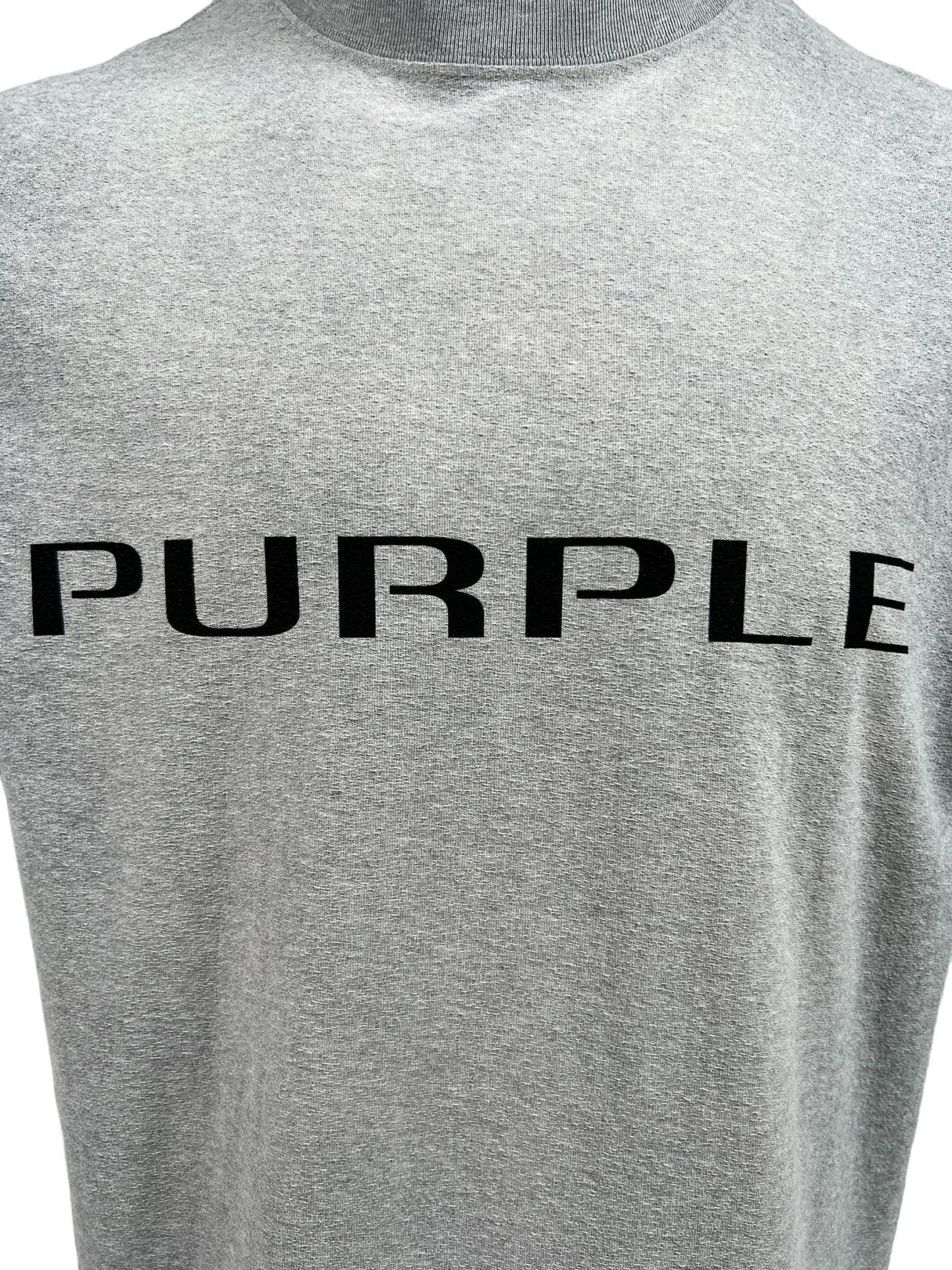 The Purple Brand P104-JWHG Textured Jersey Tee Heather, made from 100% cotton jersey knit, prominently displays the word "PURPLE" in bold black uppercase letters on the front, capturing the distinctive style of PURPLE BRAND.