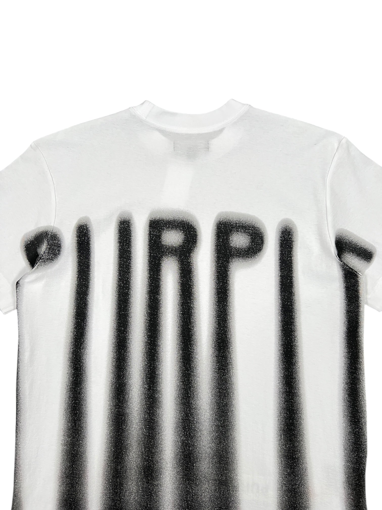 The Purple Brand P104-TBWB Textured Jersey SS Tee in white is a 100% cotton graphic t-shirt featuring "PURPLE" spray-painted in black with elongated, dripping letters for a bold streetwear style.