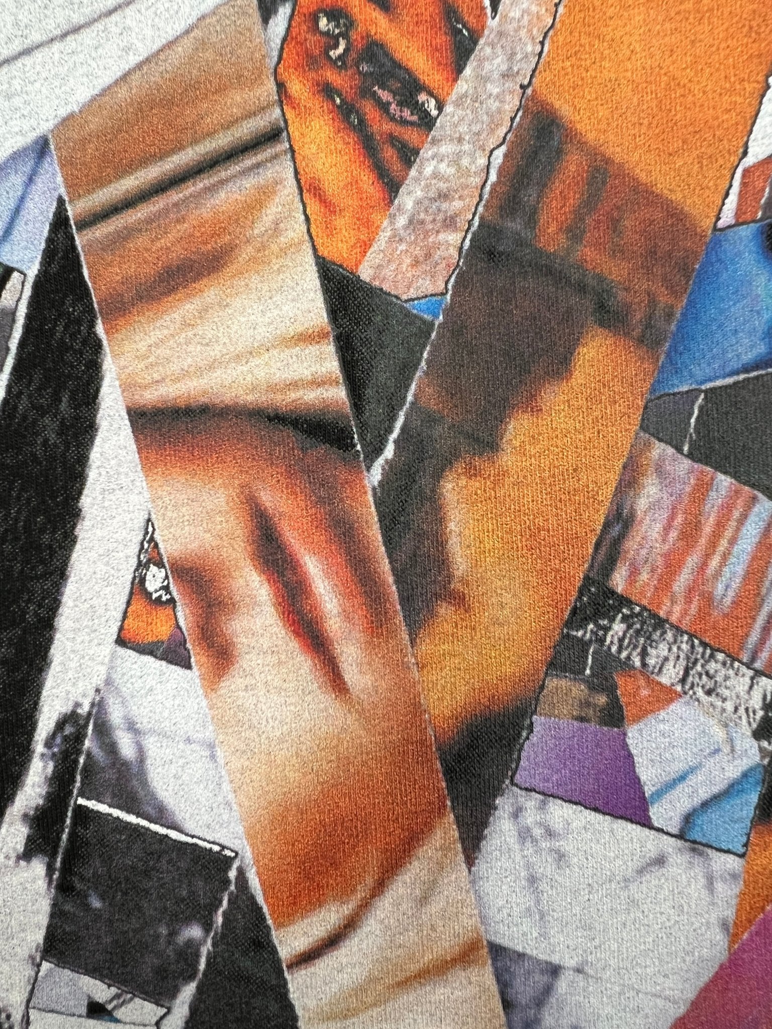 The Purple Brand P109-CBSC Clean Jersey ss Tee Blk features abstract torn paper strips in various colors and textures, perfectly complementing a graphic t-shirt by PURPLE BRAND.