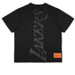 The Purple Brand P142-MNLA824 LA Lakers Mesh Tee in black features "LAKERS" in a vertical, stylized font and an orange "PURPLE" label at the bottom. Ideal for NBA enthusiasts.