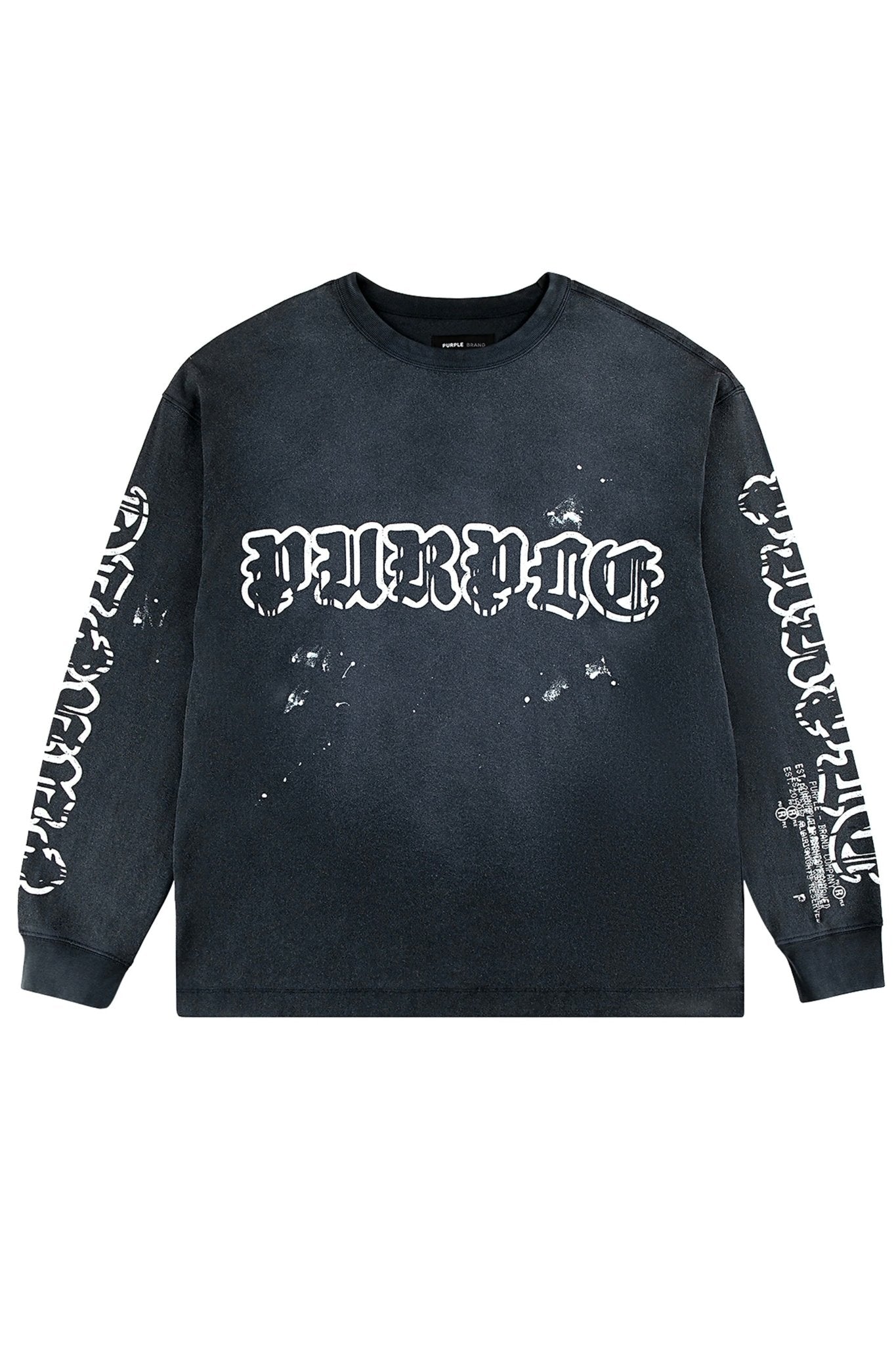 The Purple Brand P204-JWGW Textured Jersey LS Tee in black features "PURPOSE" in white gothic lettering on the front and sleeves. It has a distressed, edgy look with hand-done paint splatters, embodying the Gothic Purple Brand logo essence.
