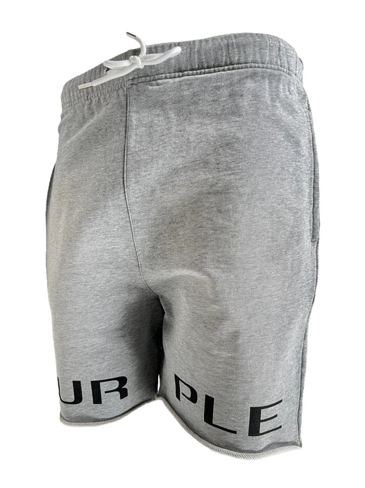 Gray sweat shorts with a white drawstring and the word "PURPLE BRAND" printed on the left leg, displayed against a black background.