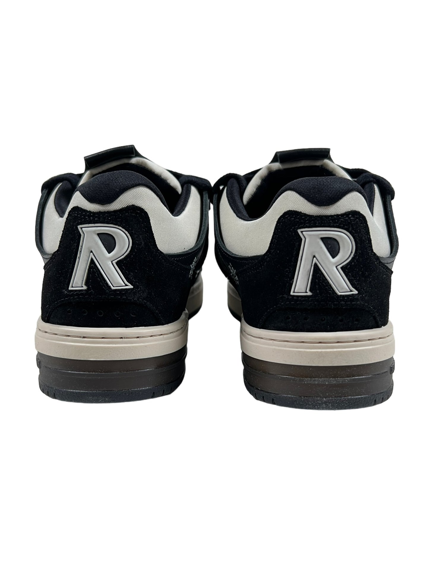 Rear view of a pair of REPRESENT black vintage white sneakers with a white and gray trim, featuring a bold "r" on each heel.