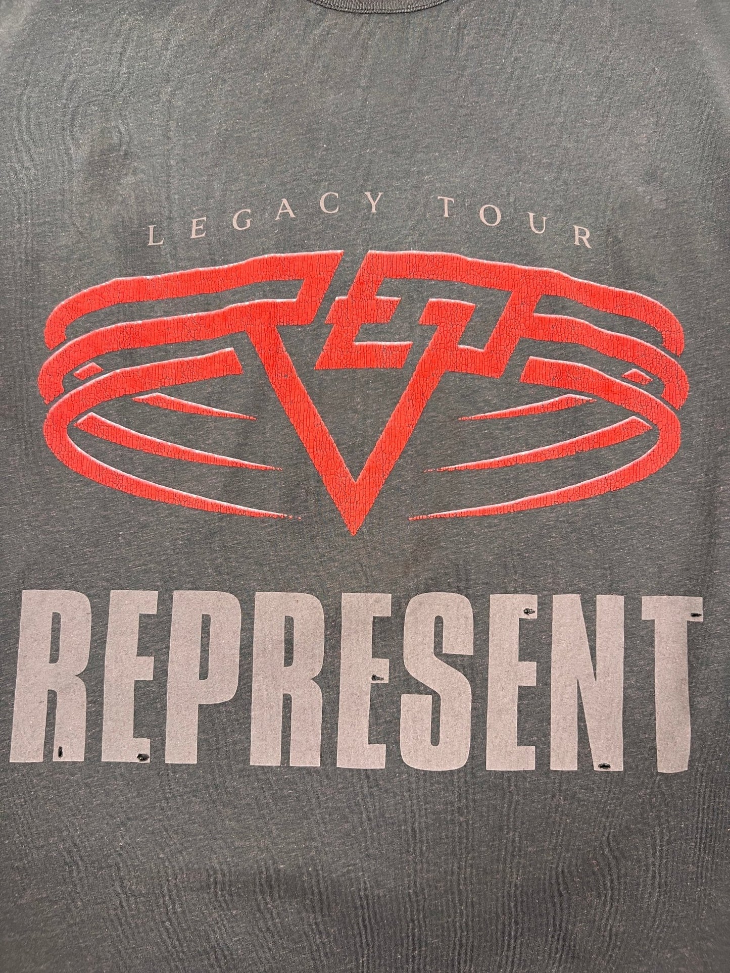 The REPRESENT MLM100176-17 Living Legacy T-shirt Nero features red and white graphics on organic cotton, with "LEGACY TOUR" above a bold red logo and "REPRESENT" at the bottom for standout style.