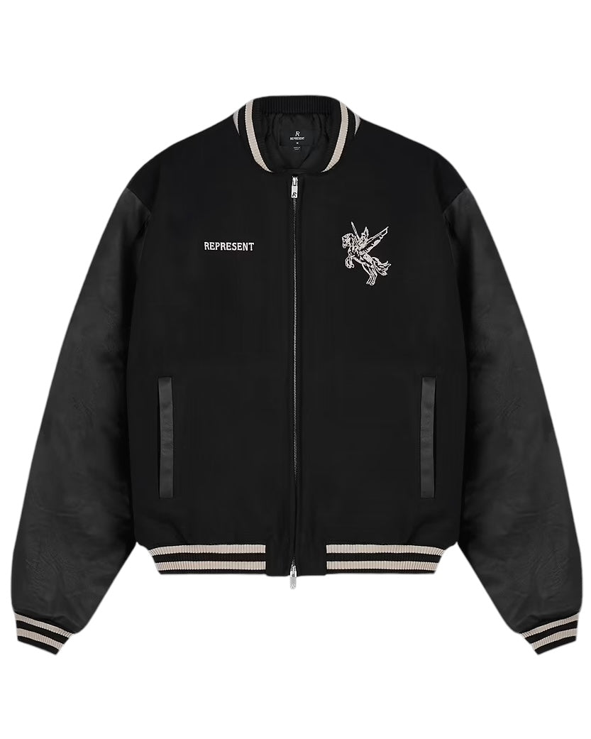 The Represent MLM1127 Bellerophon Wool Varsity Jacket in black features contrasting beige stripe accents on the cuffs and collar, RiRi zippers, and an embroidered winged mascot design with "REPRESENT" on the chest.