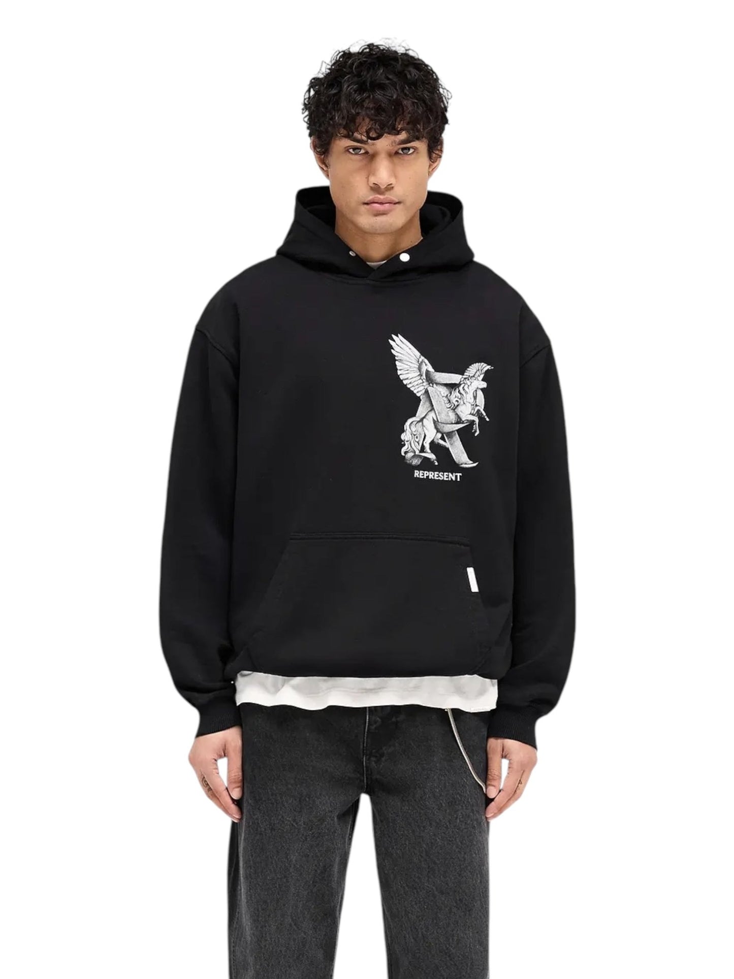 A person is wearing the Represent MLM41065 Elegance In Motion Hoodie in Black by REPRESENT, featuring a graphic of a winged creature on the front, layered over a white shirt and paired with black jeans.