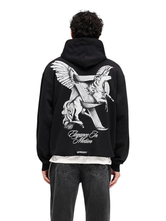 A person is seen from the back wearing a Represent MLM41065 Elegance In Motion Hoodie in black, which displays a design with two winged horses and "REPRESENT." They pair it with dark jeans.