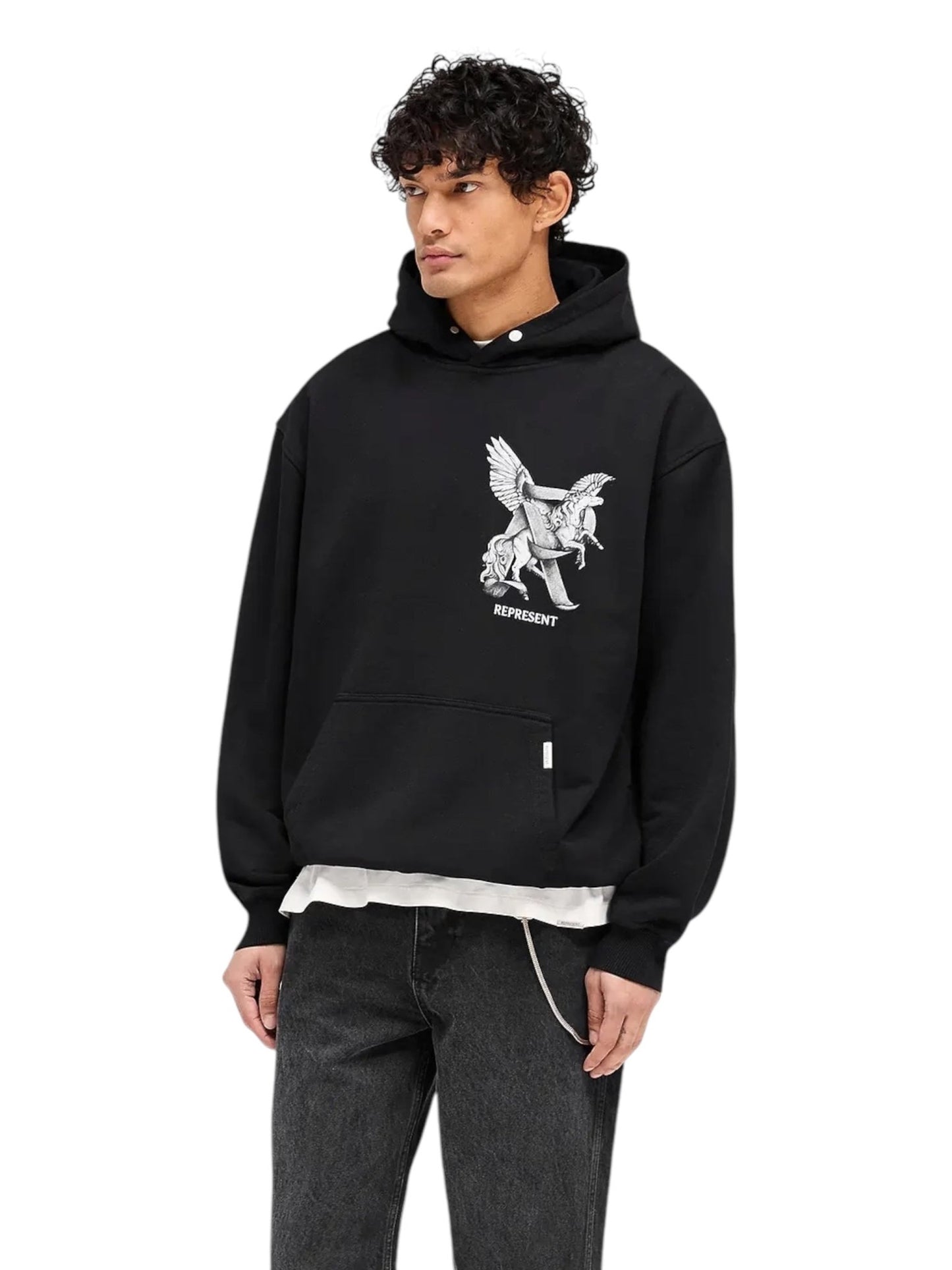 A person in the Represent MLM41065 Elegance In Motion Hoodie in Black from REPRESENT and dark jeans stands against a white background.