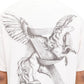 A person is seen from behind wearing the Represent MLM41066 Elegance in Motion Tee in White. The tee features a winged horse, a flowing mane intertwined with a ribbon, and is crafted by REPRESENT from soft jersey cotton for both comfort and style.