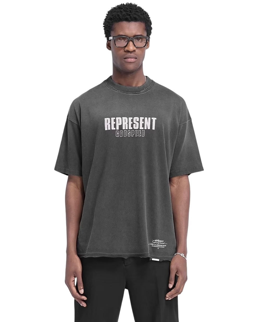 A person wearing glasses and a Represent MLM4222 Godspeed T-shirt in aged black, featuring a cracked "REPRESENT GODSPEED" graphic on the front, stands against a plain white background.