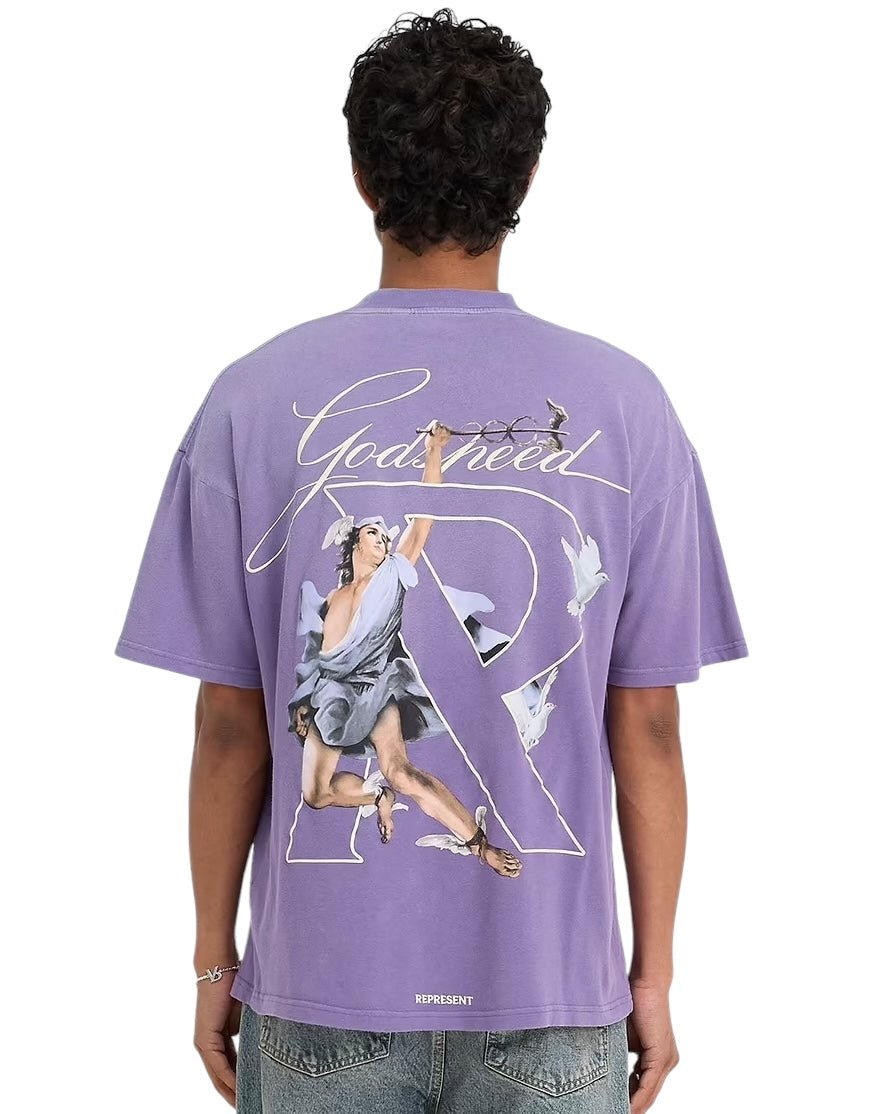 Someone dressed in an oversized Represent MLM4228 Hermes T-shirt Purple from REPRESENT, adorned with an artistic high-density screen print graphic on the back showcasing a person with wings and decorative text.