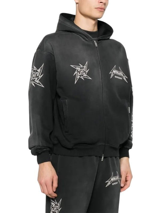 Someone wearing the Represent MLM4370 40 Year Anniversary Zip Hood Blk from REPRESENT, featuring white star logos and text, celebrates Metallica's 40 years, paired with matching black pants.