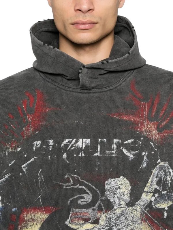 Someone wearing the REPRESENT Master of Puppets Hood in faded charcoal grey with a red and white graphic design.