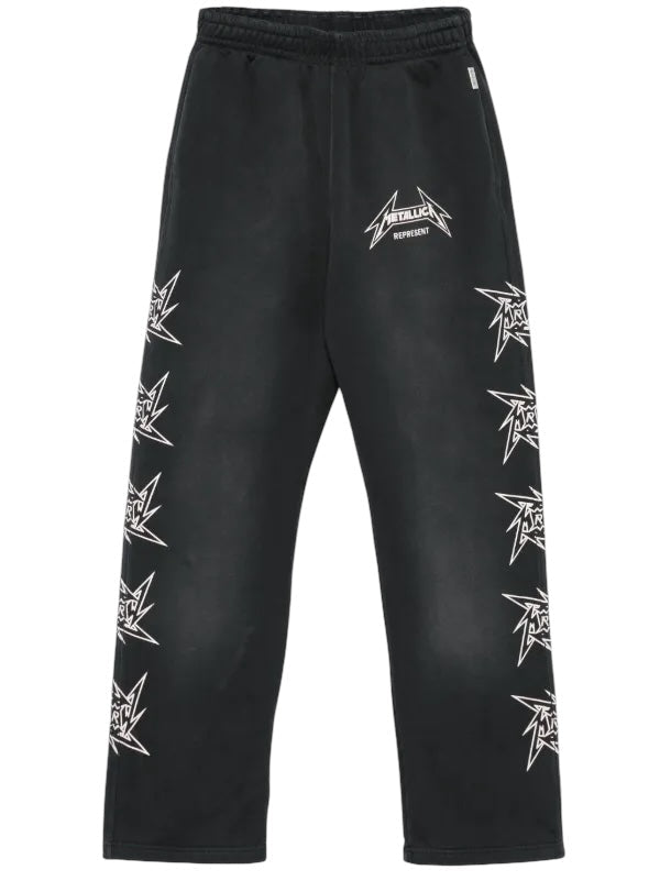 The Represent MLM4376 40 Year Anniversary Pants Blk by REPRESENT showcase white Metallica logos on the sides and front, complemented by an elasticated waistband for comfort and a loose fit—ideal for casual outings.