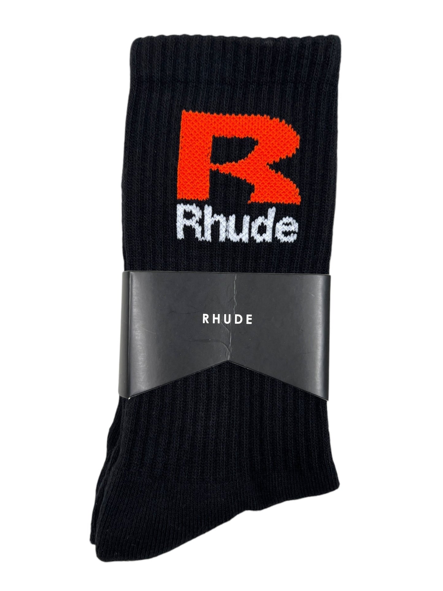 Black cotton socks featuring a large orange "R" and "Rhude" in white text on the ankle, held together by a black band labeled "RHUDE R SOCK BLACK/ORANGE" from the brand RHUDE.