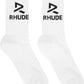 The Rhude Trophy Racing Sock in white/black features a calf-high design with jacquard "RH" logos and "RHUDE" text on the sides, made from a comfortable knit stretch cotton-blend.