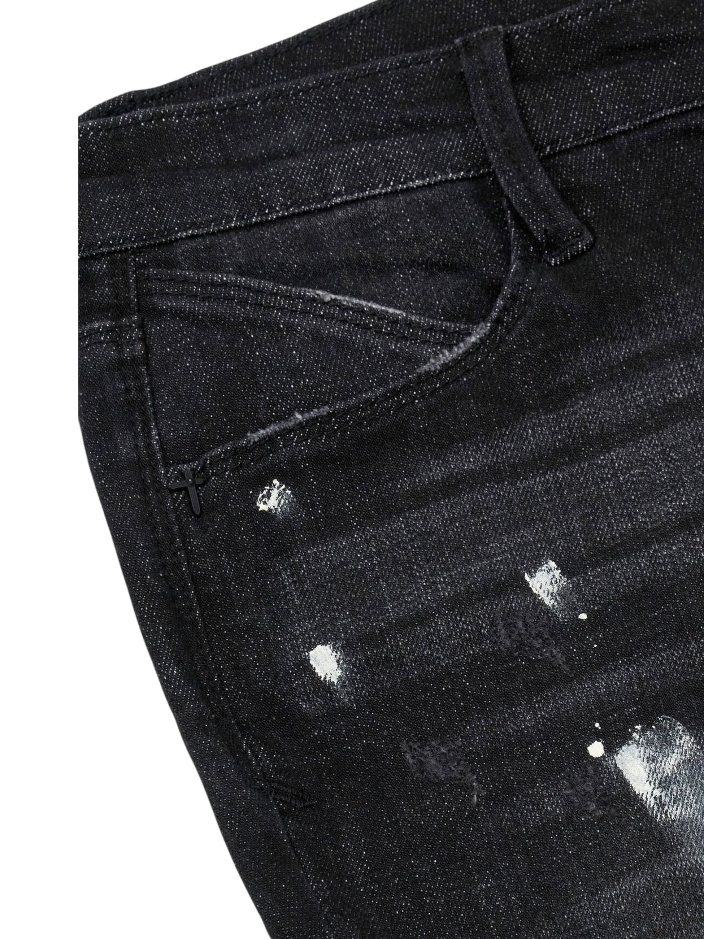 Close-up of the RTA Clayton Jean Distressed Charcoal Paint Black: a skinny-fit, 5-pocket jean from RTA with front pocket, belt loop, and white paint splatter details.