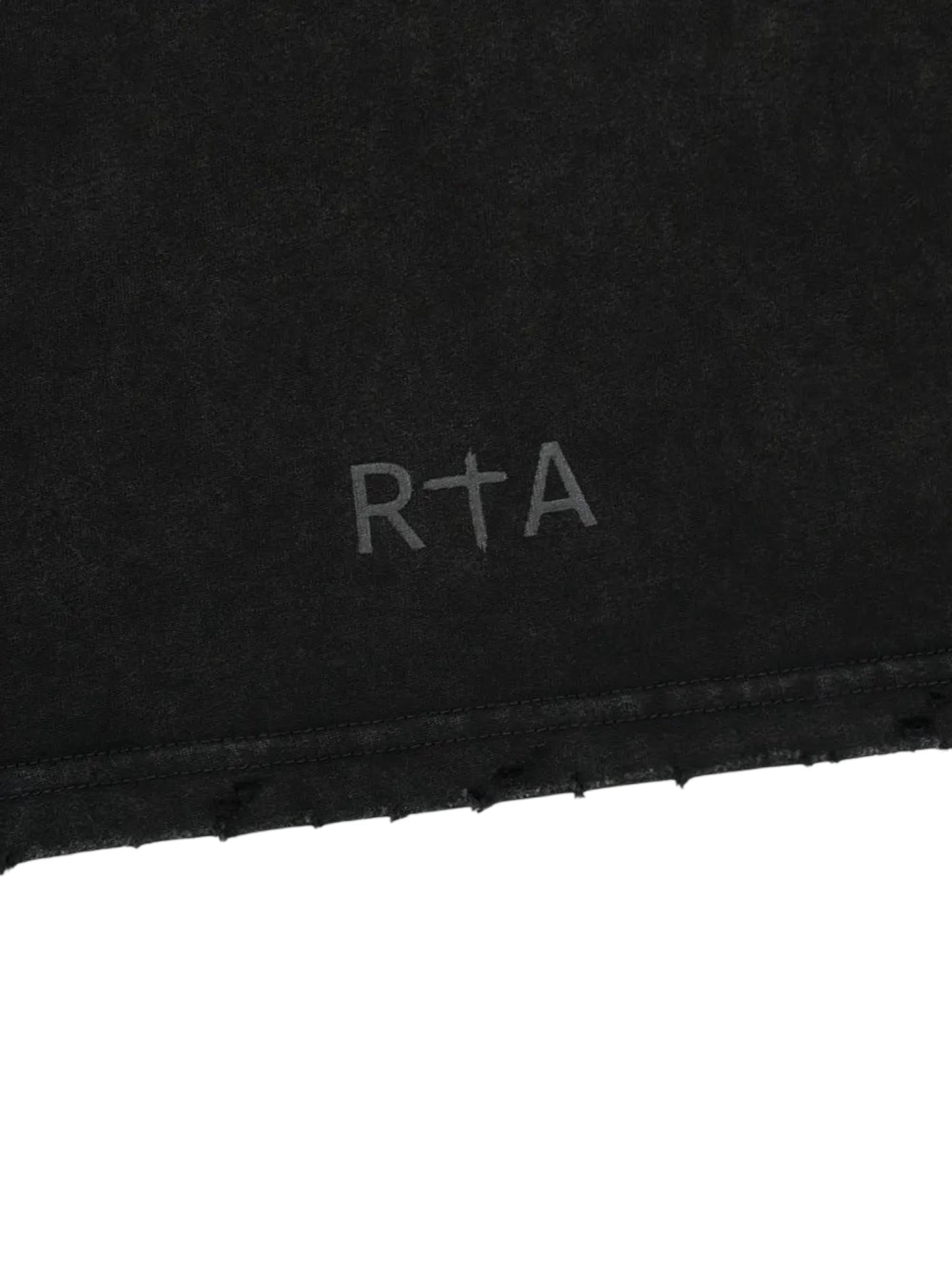 The RTA Colin Black Cyber Sigilism tee features an oversized fit with a light gray RTA logo, incorporating a cross symbol into the letter T near the hem for a cyber-inspired look.