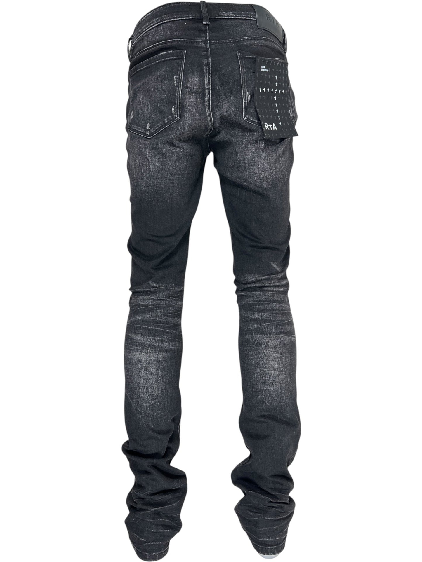 Model wears RTA Olivier Stacked Graphite Fade Cross Black jeans, viewed from the back, highlighting visible pockets and subtle distressing details in soft cotton.