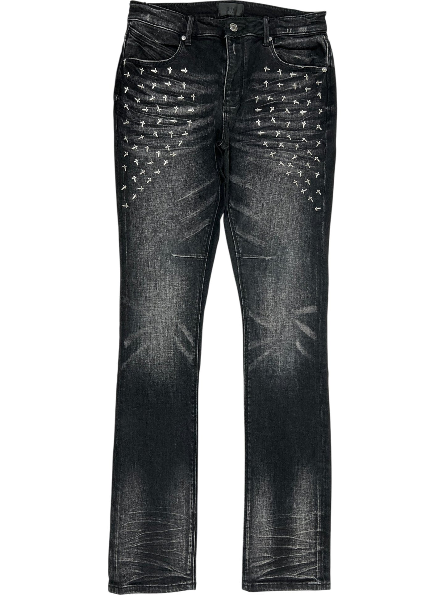 A pair of RTA Olivier Stacked Graphite Fade Cross Black jeans in soft cotton, featuring a stylish graphite fade and silver stud embellishments arranged in rows on the upper front thighs.