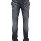 The RTA Olivier Stacked Graphite Fade Cross Black jeans feature white X stitches on the front thighs and subtle knee and hem wrinkling, capturing RTA’s signature stacked style in a black cotton denim graphite fade wash.
