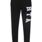 RTA Owen black collegiate sweatpants by RTA, featuring a drawstring waist and a bold white vertical RTA logo on the left thigh.