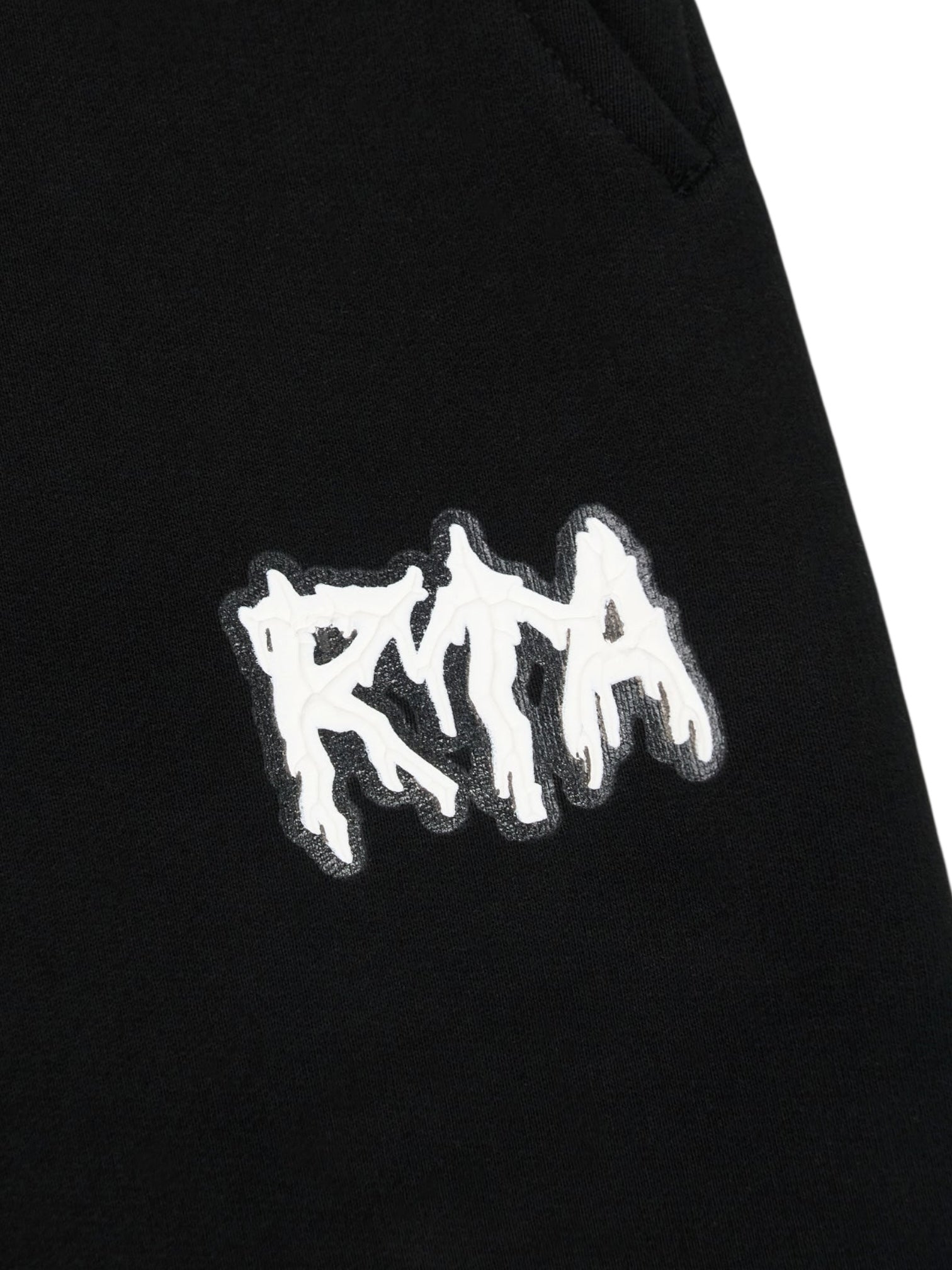 Close-up of the RTA Rafa Black Cyber Lost Frequencies sweatpant by RTA, showcasing a white stylized “RTA” patch stitched on for a cyber-inspired accent.