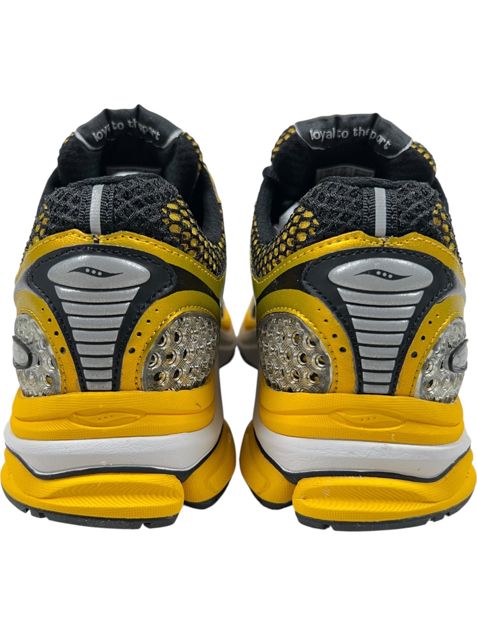 The SAUCONY Progrid Triumph 4 (S70704-16) Lemon Chrome athletic shoes in yellow, black, and silver feature mesh uppers with Arch-lock technology and "loyal to the" printed on the inner lining.