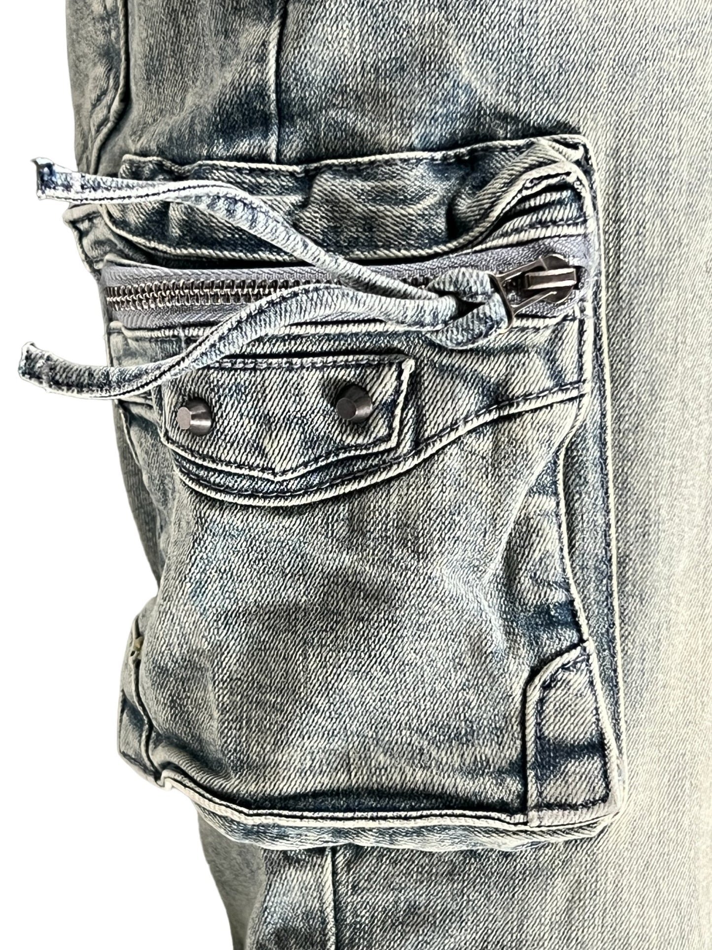 Close-up of a SERENEDE GENESYS cargo jeans pant pocket with zipper detail.