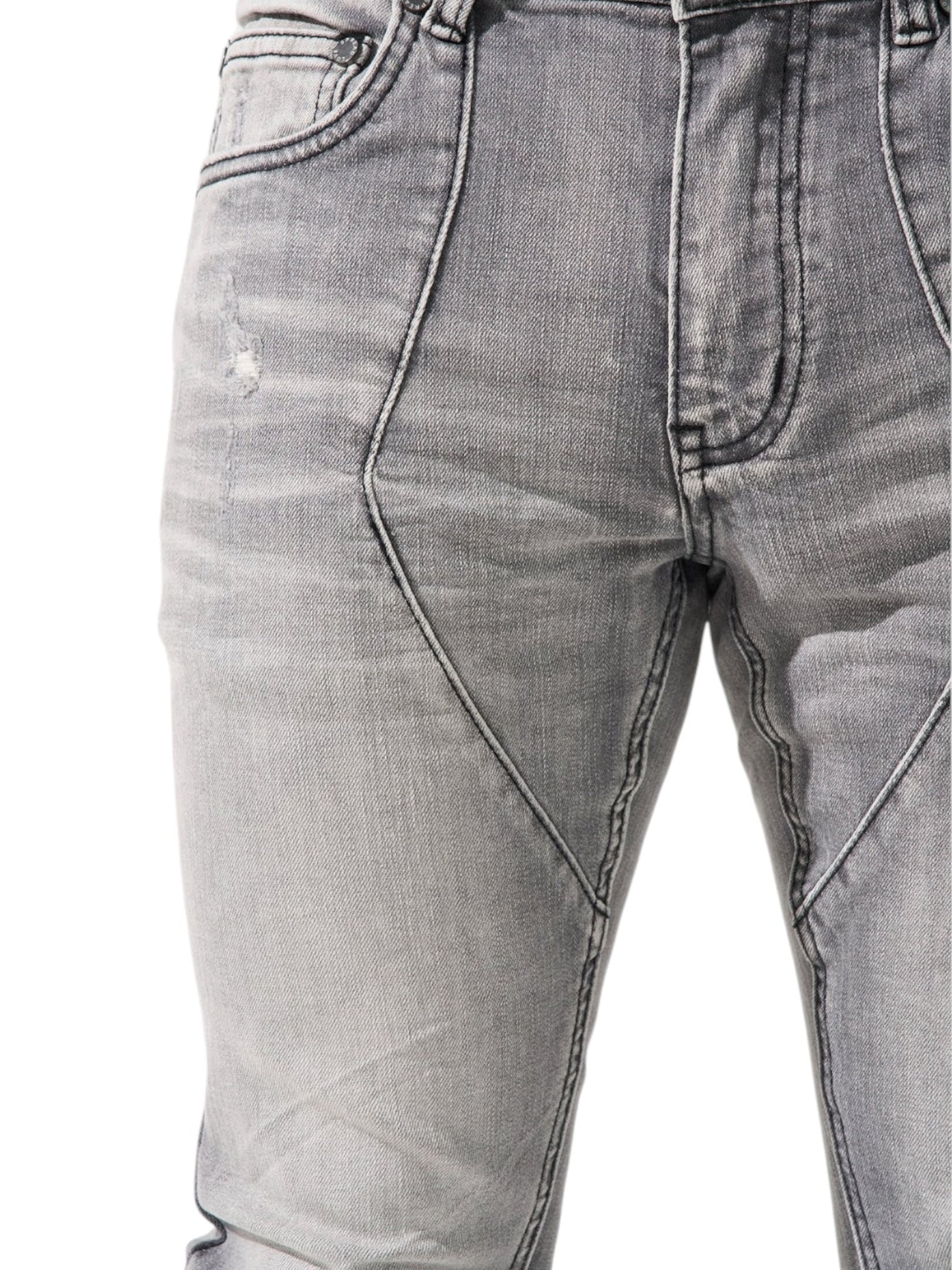 The Serenede Noctis Stacked Jeans Grey by SERENEDE feature distressed grey denim with visible seams and a zippered fly, highlighting stacked denim from waist to knee on a white background.