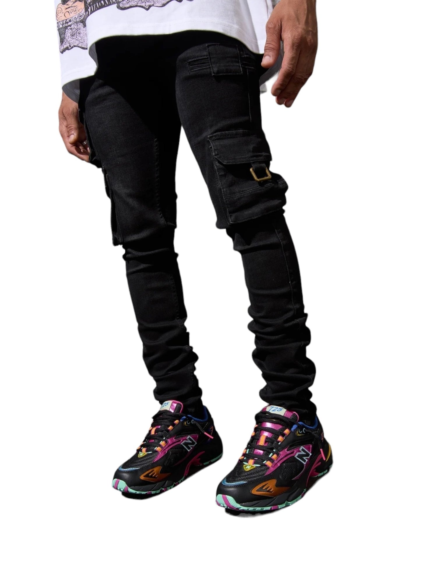 Person wearing SERENEDE Panthera Cargo Jeans in Washed Black and colorful sneakers, standing against a white background.