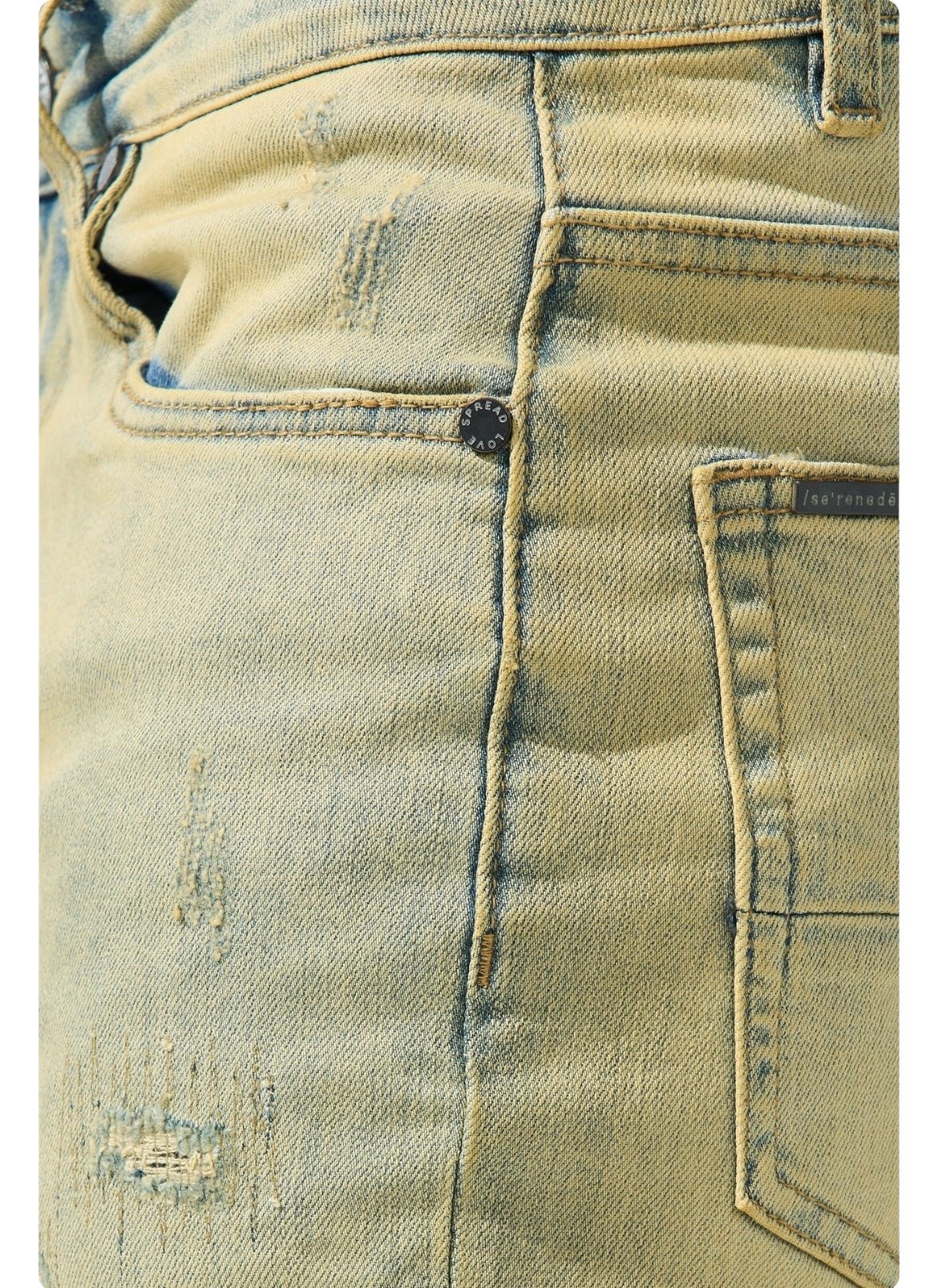 Close-up of the front pocket and hip area of the SERENEDE SOL JEANS RISE, distressed light blue slim fit men's jeans by SERENEDE, showcasing fabric texture and stitching details made from stretch cotton for added comfort.