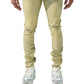 A person wearing SERENEDE SOL JEANS RISE, which are distressed beige slim fit jeans made of stretch cotton, along with a white shirt and white sneakers, stands facing forward on a white background.