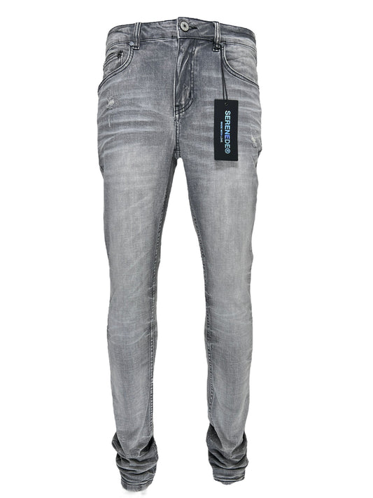 A pair of faded grey wash SERENEDE TITAN jeans with a tag attached, displayed against a white background.